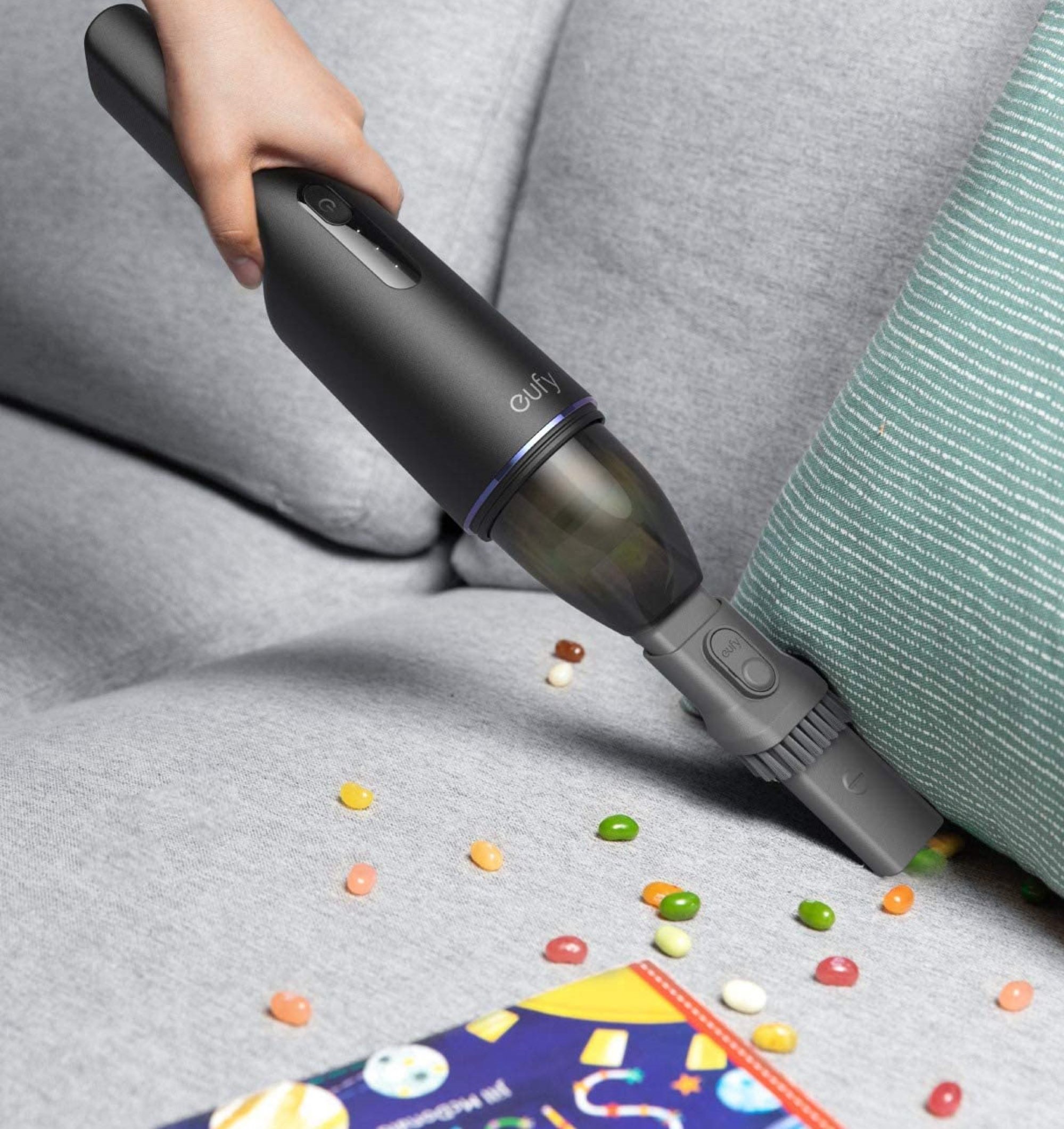 Eufy by Anker vacuum cleaning a couch
