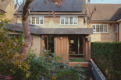 allotment cottage rear facade with timber and soft hues