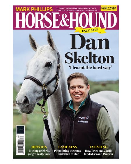 National Hunt racehorse trainer Dan Skelton smiles at the camera holding a grey racehorse wearing a leather headcollar on this cover of Horse & Hound magazine, on sale Thursday 29 October