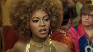 Beyonce in conversation with her back to Mike Myers in Austin Powers in Goldmember.