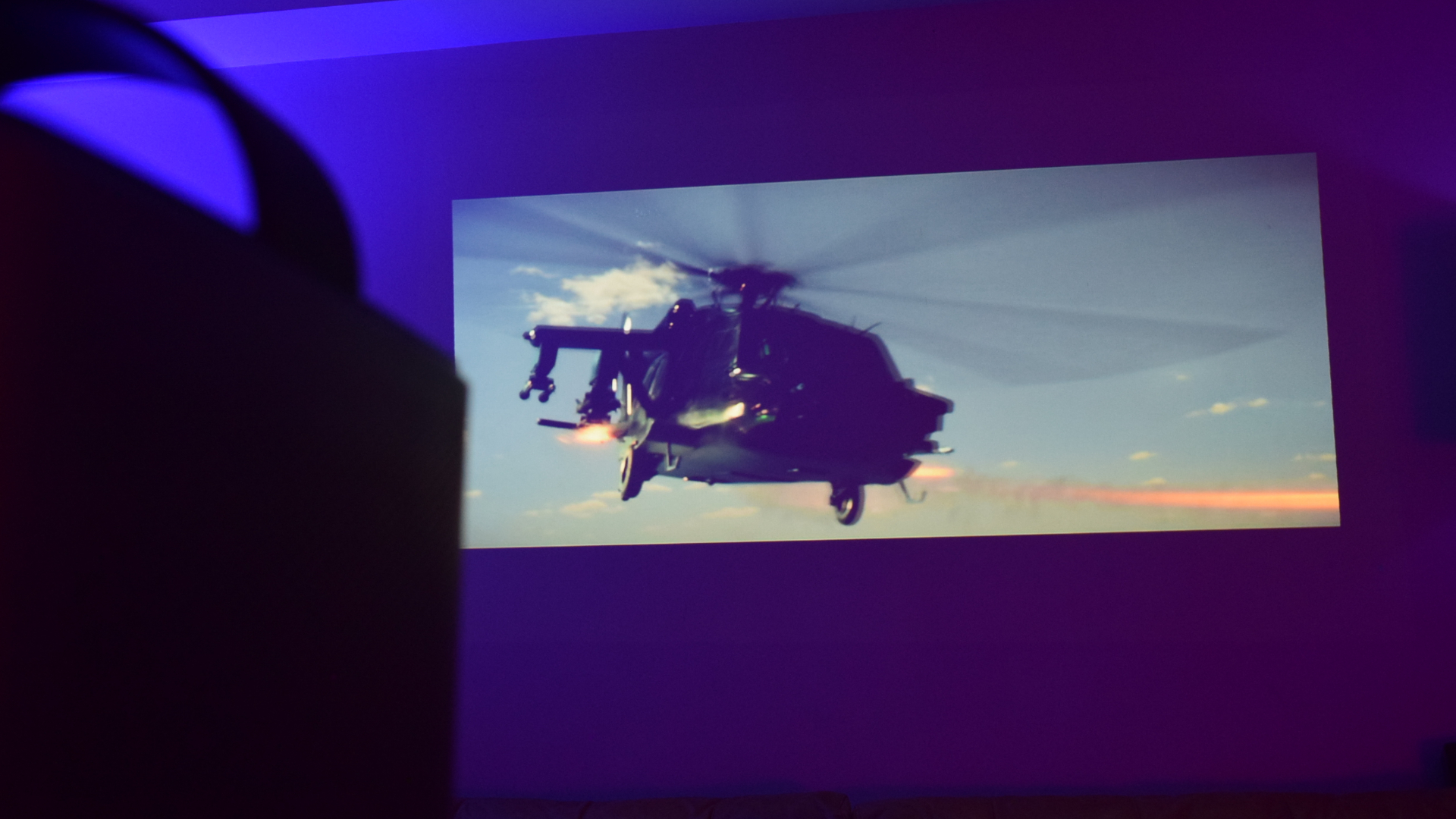 Anker Nebula Mars 3 Air projector projecting image of a helicopter from the movie Expendables 4