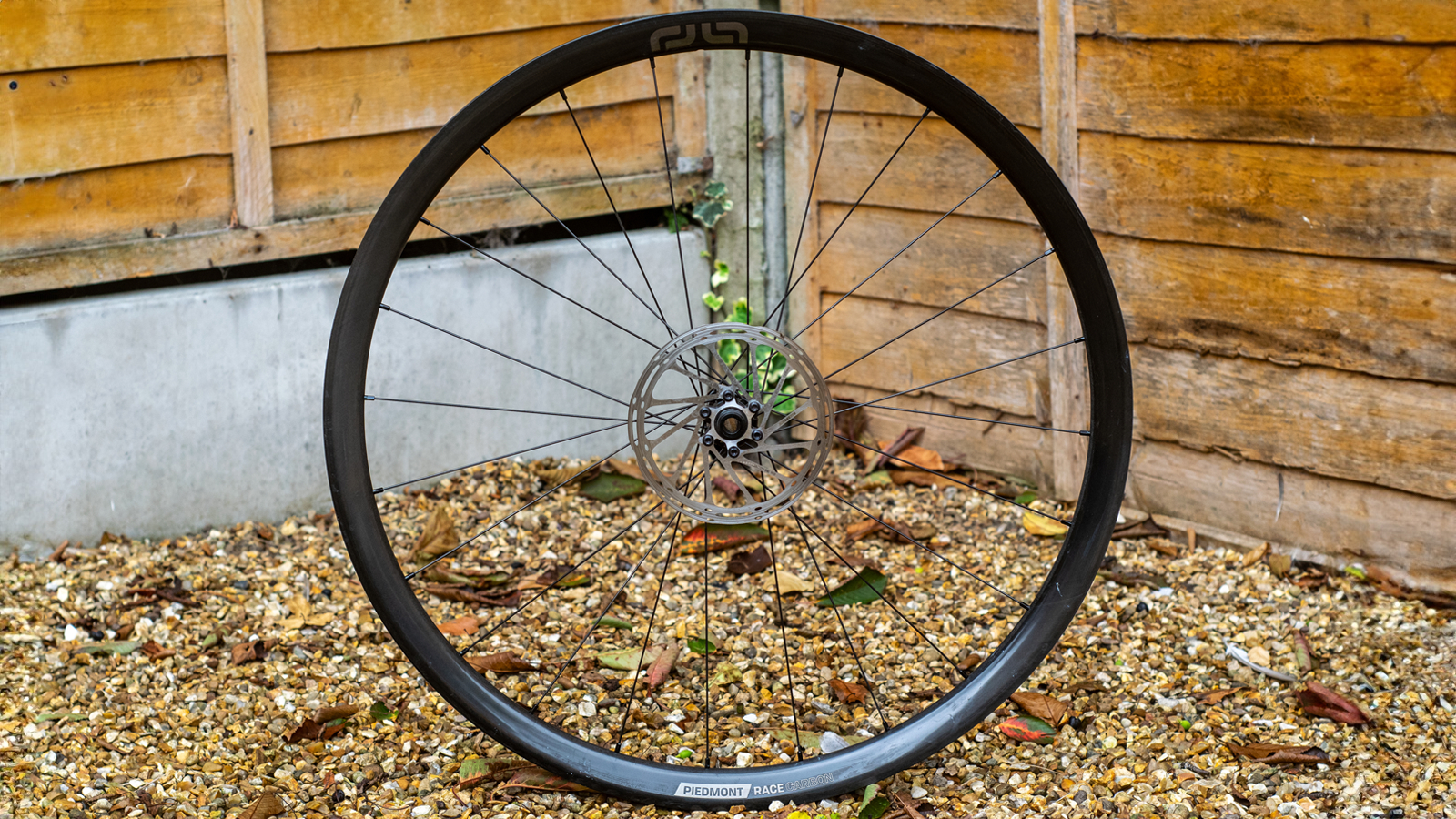 e*thirteen Piedmont Race pictured against a fence