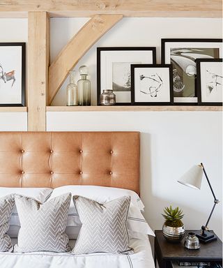 barn style bedroom with leather headboard and shelves