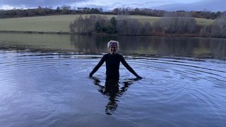 Fiona wearing the Finisterre Women's Nieuwland 2mm Yulex Long Sleeve Shorty Wetsuit