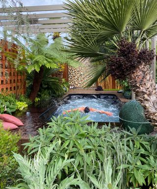 swimmer in pool in Kate Gould's show garden at chelsea flower show 2022