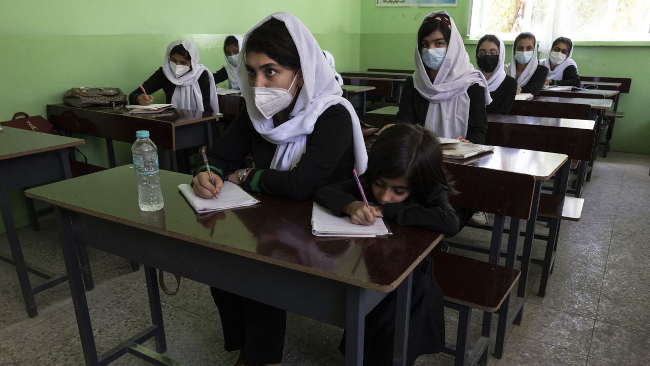 kabul, afghanistan july 24 mozhda, 16, a 10th grade student listens during class at the zarghoona high school on july 24 2021 in kabul, afghanistan the zarghoona girls high school is one of the largest in kabul with 8,500 female students attending classestoday was a brief school opening after almost a two months break due to coronavirus currently there is widespread fear that the taliban who already control around half the country will reintroduce its notorious system barring girls and women from almost all work, and access to education the ministry of education has announced the opening of schools, but there are mixed reports in many areas where the taliban have taken control or where fighting is ongoing photo by paula bronstein getty images