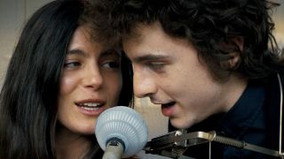 Still frame of Timothee Chalamet and Monica Barbaro in A Complete Unknown.