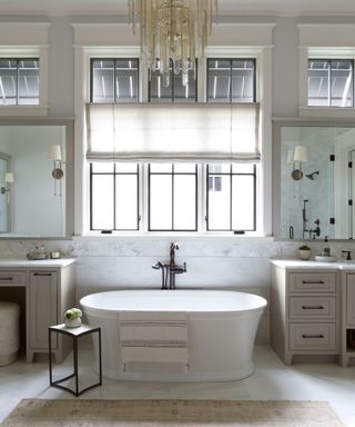 White bath and sink, black framed windows