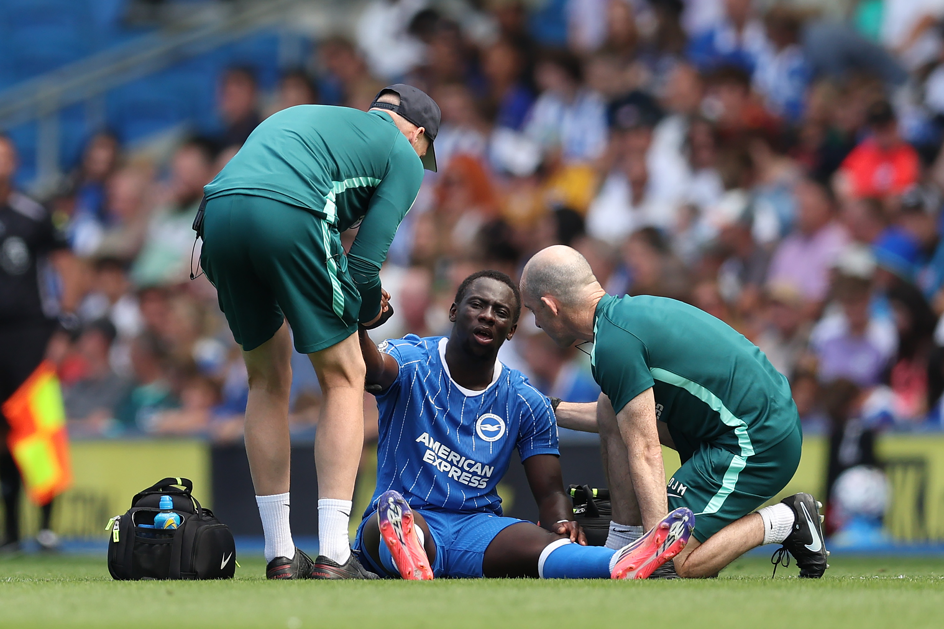 Yankuba Minteh of Brighton &amp;amp; Hove Albion receives treatment during the pre-season friendly match against Roma