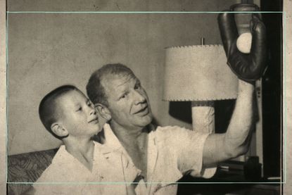 Where are Mike and Bill Veeck now, as illustrated by Mike Veeck sitting with a young Bill Veeck