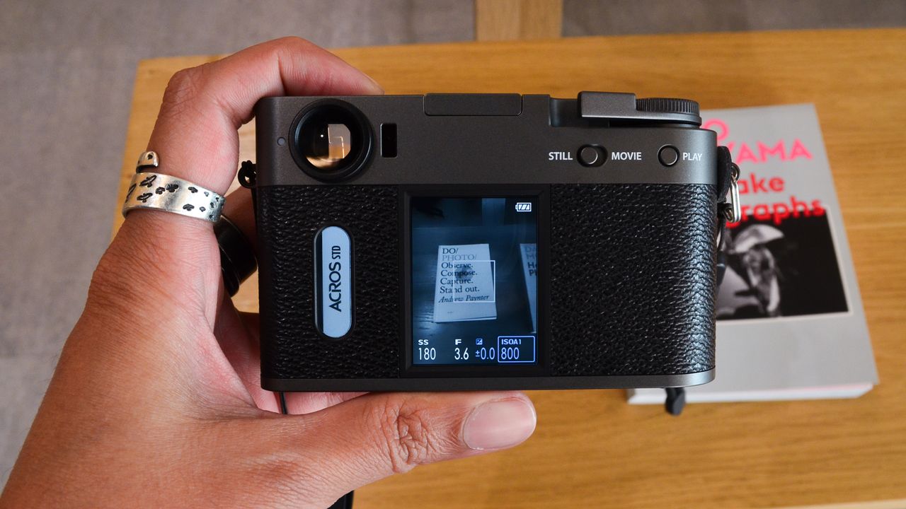 A charcoal Fujifilm X half digital film camera