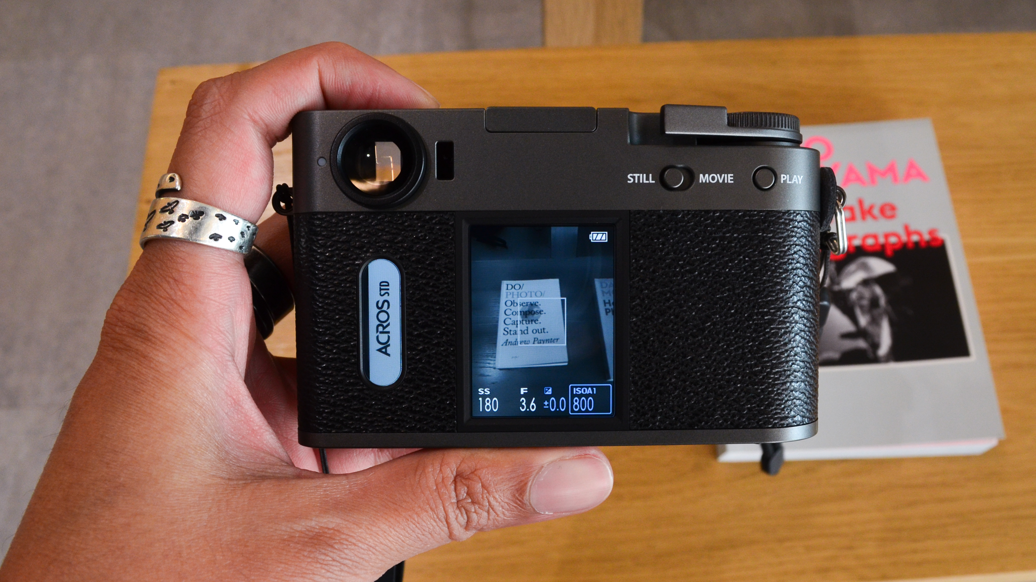 A charcoal Fujifilm X half digital film camera