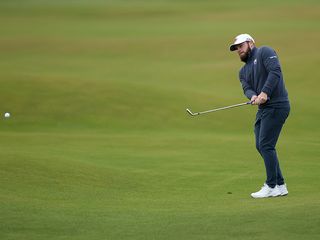 Tyrrell Hatton hitting a pitch shot on the 18th fairway at The Old Course, St. Andrews