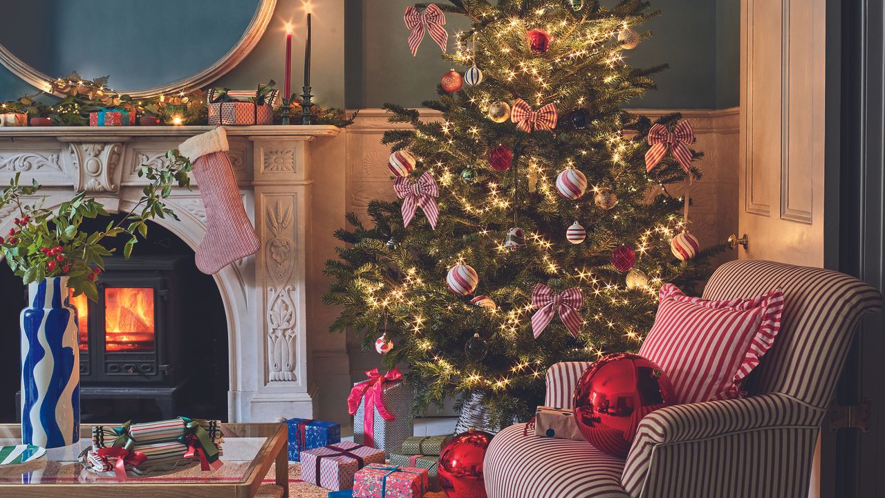 Christmas living room decori deas with striped chair and bows.