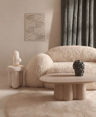 A living room with a fluffy sofa