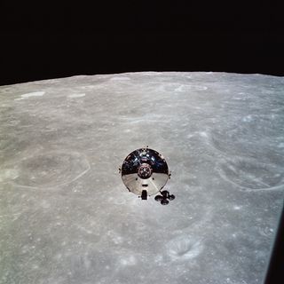 The Apollo 10 Command and Service Modules (CSM) are photographed from the Lunar Module (LM) after CSM/LM separation in lunar orbit.