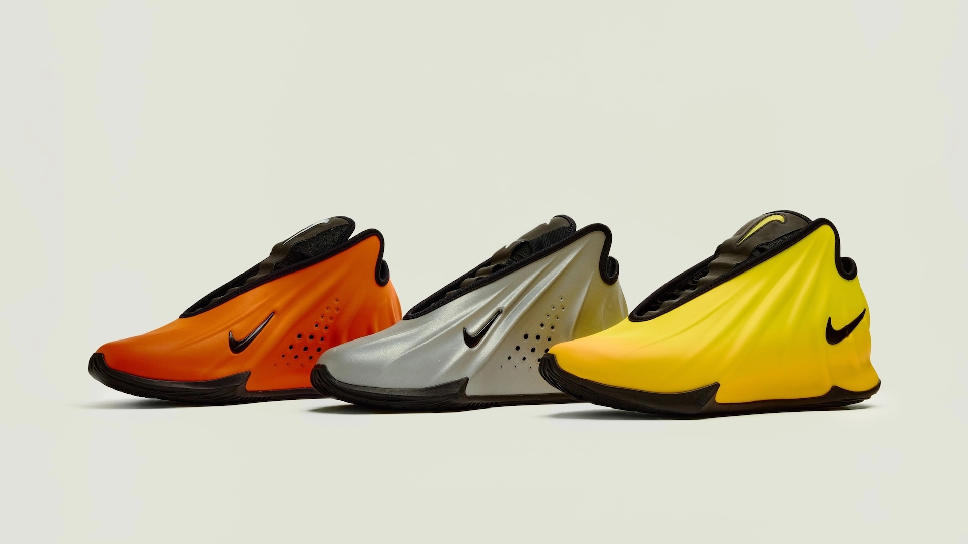 The new Nike GT Future 1 in three different colours, orange, silver and yellow