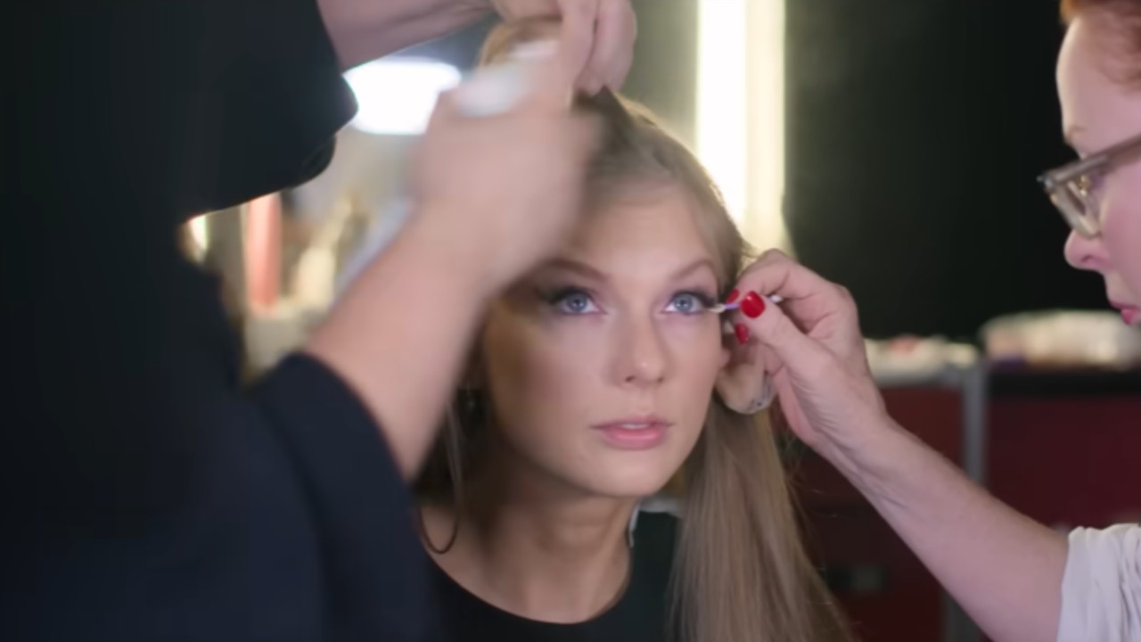 Taylor Swift getting her hair and makeup done.
