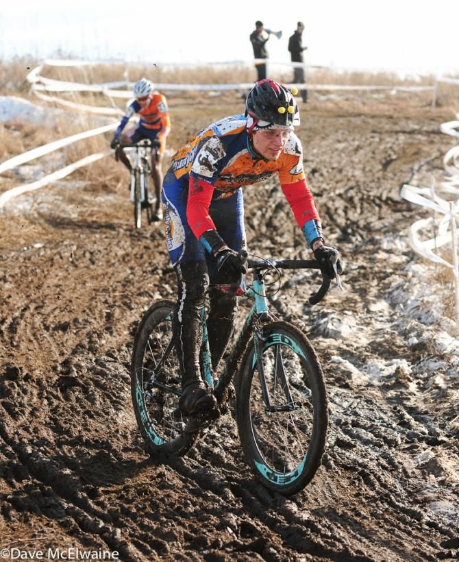 Riders descend a slick track