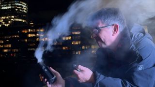 A man with smoke blowing in his face from the Telesin C40 Portable Smoke Machine