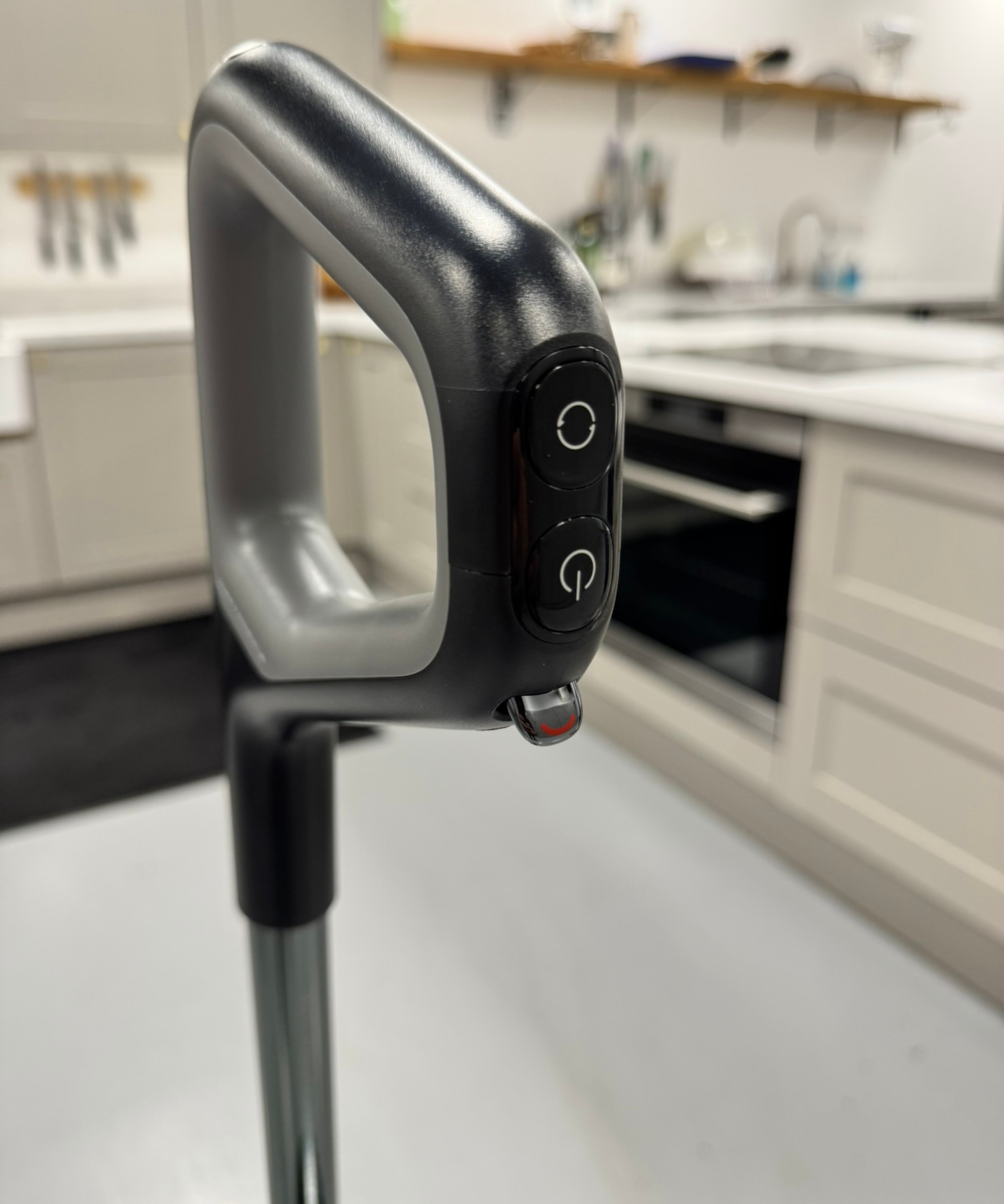 Closeup of Dreame H15 Pro Heat CarpetFlex handle showing power, mode, and large debris controls