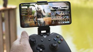 OnePlus 10T in landscape with lobby screen for Call of Duty attached to an Xbox Controller