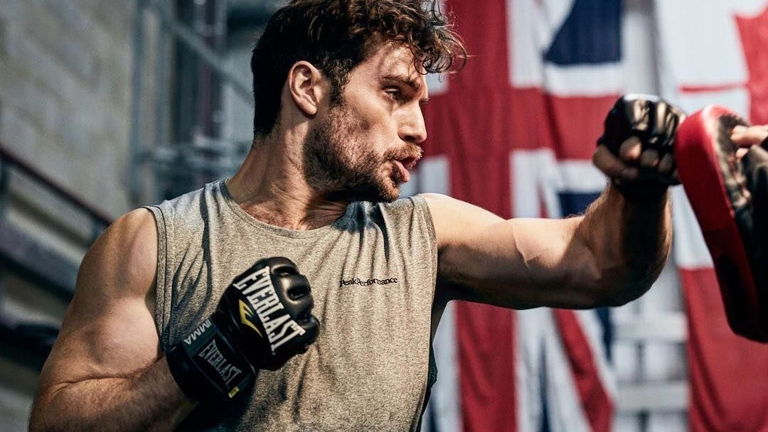 Henry Cavill Super-Jacked Next To Superman!