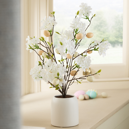 Three next easter egg trees next to each other.