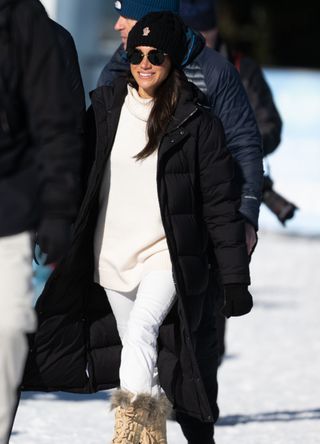 Meghan Markle wearing a puffer coat