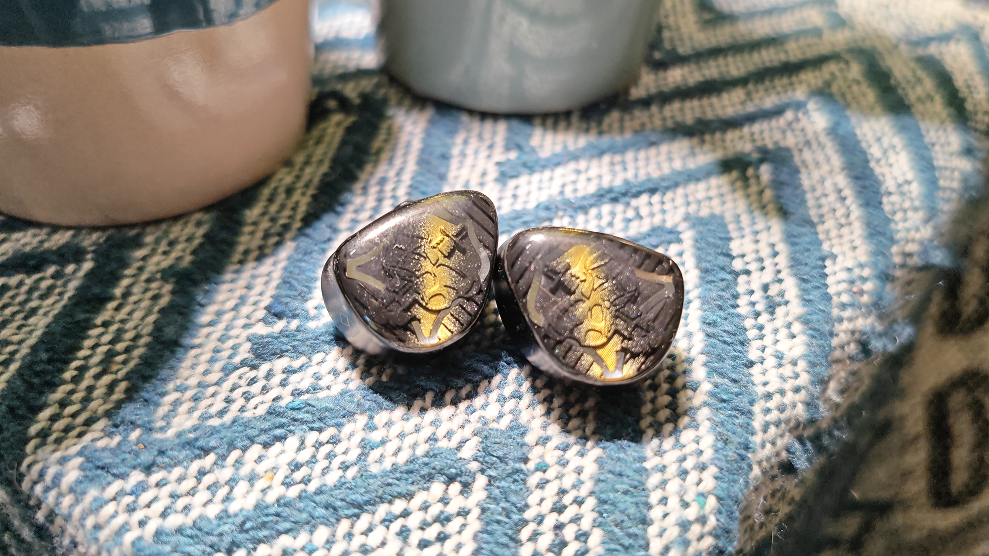 The Noble Vanguard IEMs in various positions in my home office. 