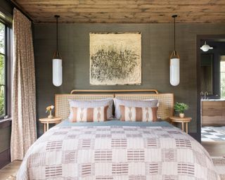 Main bedroom in muted palette in period South Carolina beach house