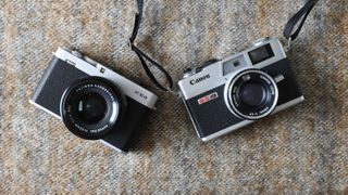 Canonet G-III QL17 camera next to a Fujifilm X-E4 camera