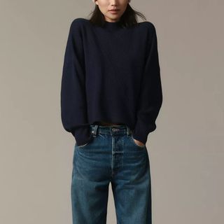 flat lay image of navy sweater