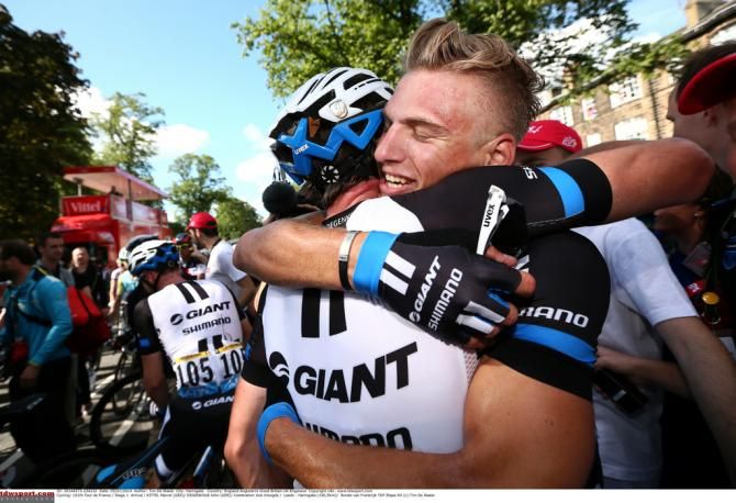 Kittel hugs his teammate after the win