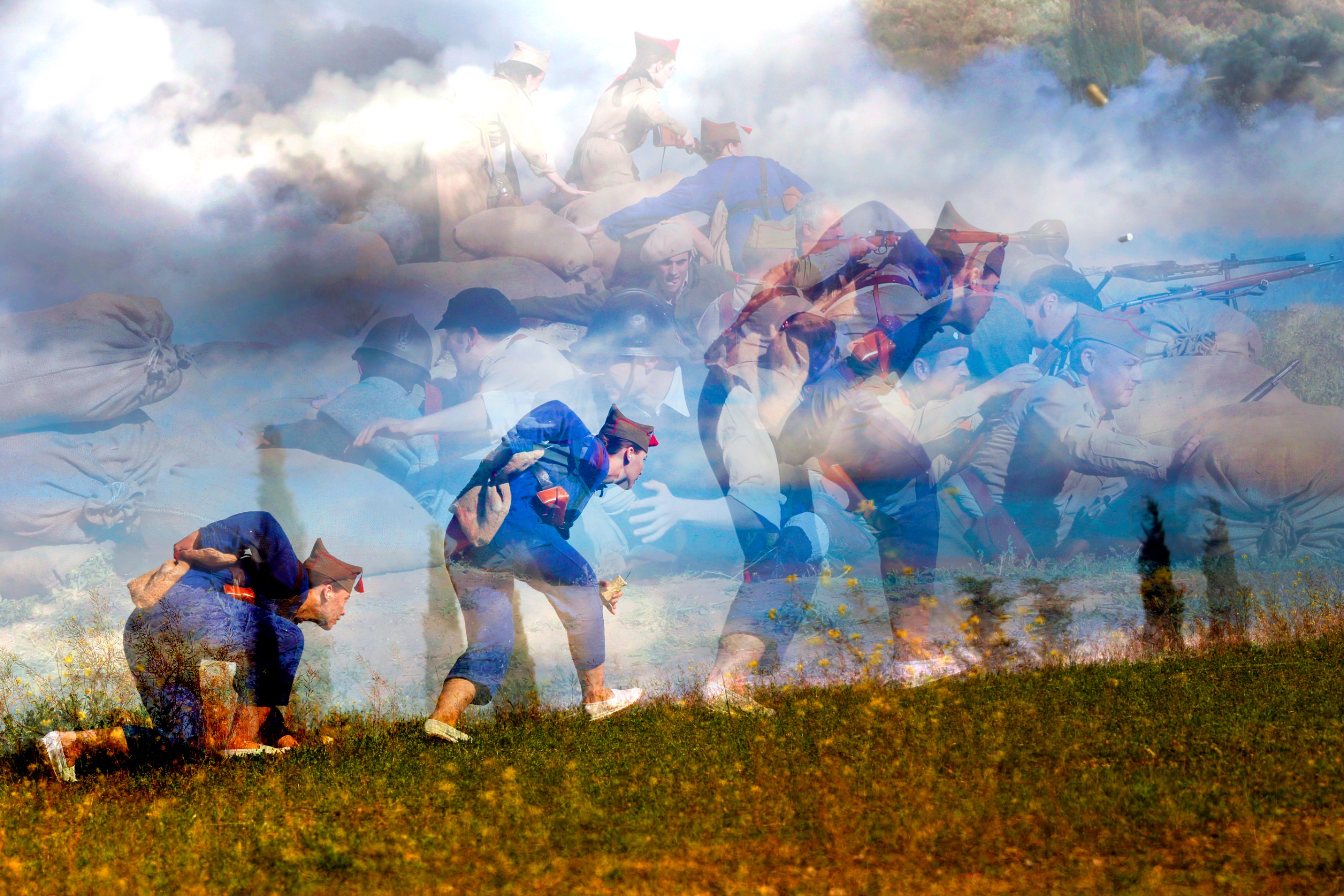 A vibrant, multi-layered double-exposure photograph depicting soldiers in blue uniforms running up a grassy hill underneath a ghostly overlay of combat troops near sandbags.