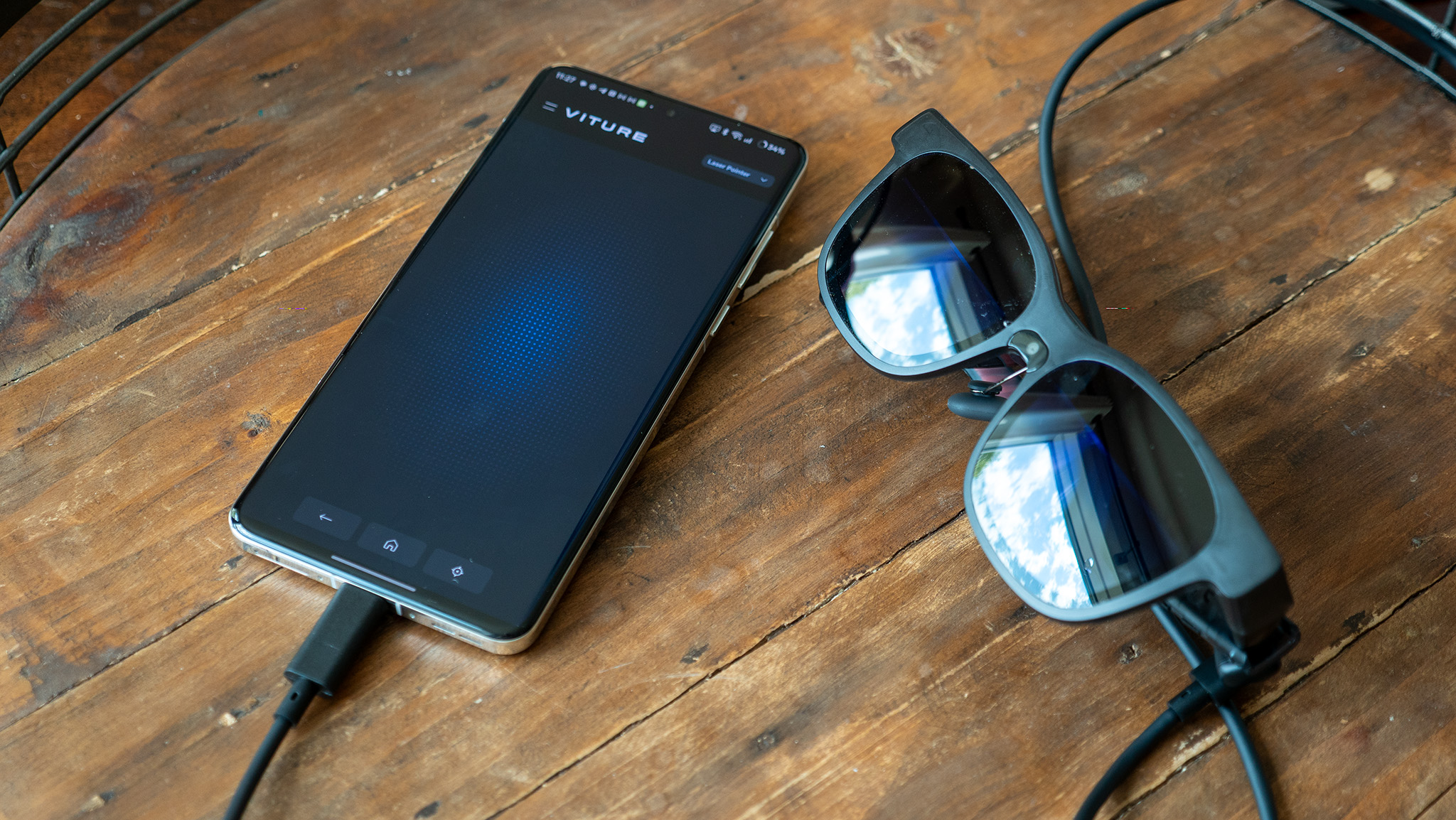 A pair of Viture Luma Pro glasses connected to the Spacewalker app running on a OnePlus 13