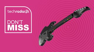 A guitar-shaped controller with colorful buttons on its neck. The main body is black