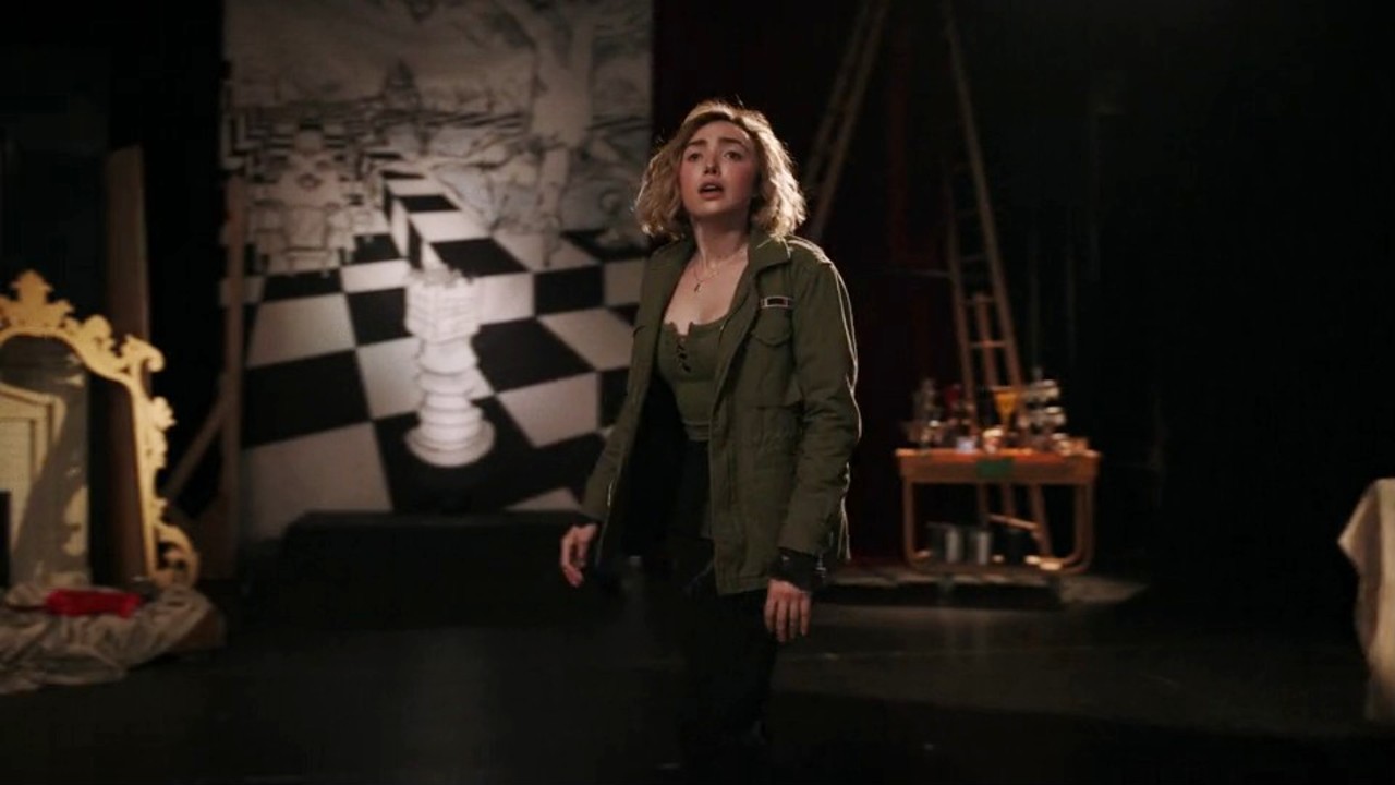 Peyton List standing on stage in School Spirits Season 3.