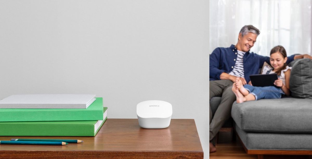 eero WiFi System on a table in front of a living room setting