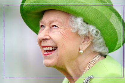 Queen Elizabeth laughing while wearing a green hat and matching dress at the Out-Sourcing Inc. Royal Windsor Cup polo match and a carriage driving display by the British Driving Society at Guards Polo Club, Smith's Lawn on July 11, 2021 in Egham, England. 