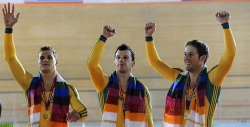Daniel Ellis, Jason Niblett and Scott Sunderland celebrate Australia's team sprint gold.