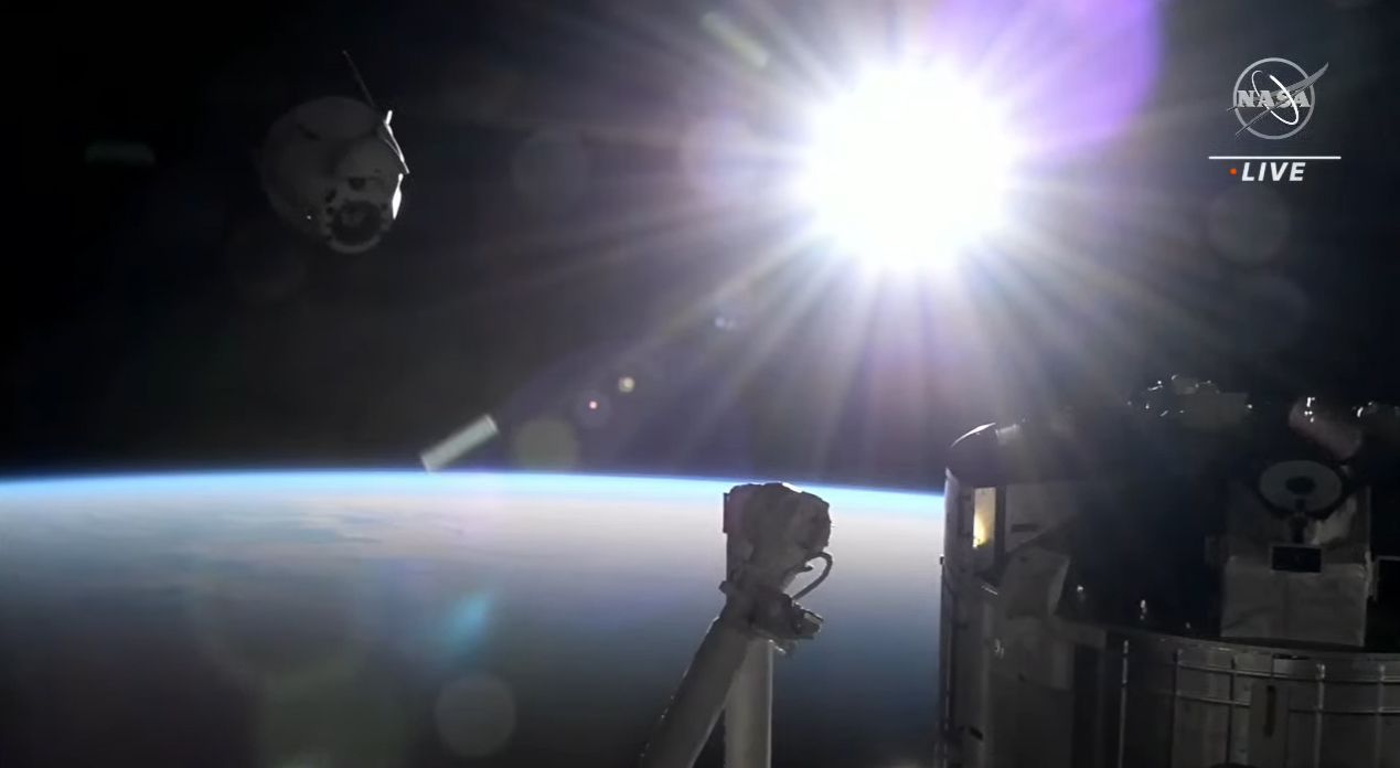 The SpaceX Dragon CRS-25 spacecraft departs the International Space Station during orbital sunrise.