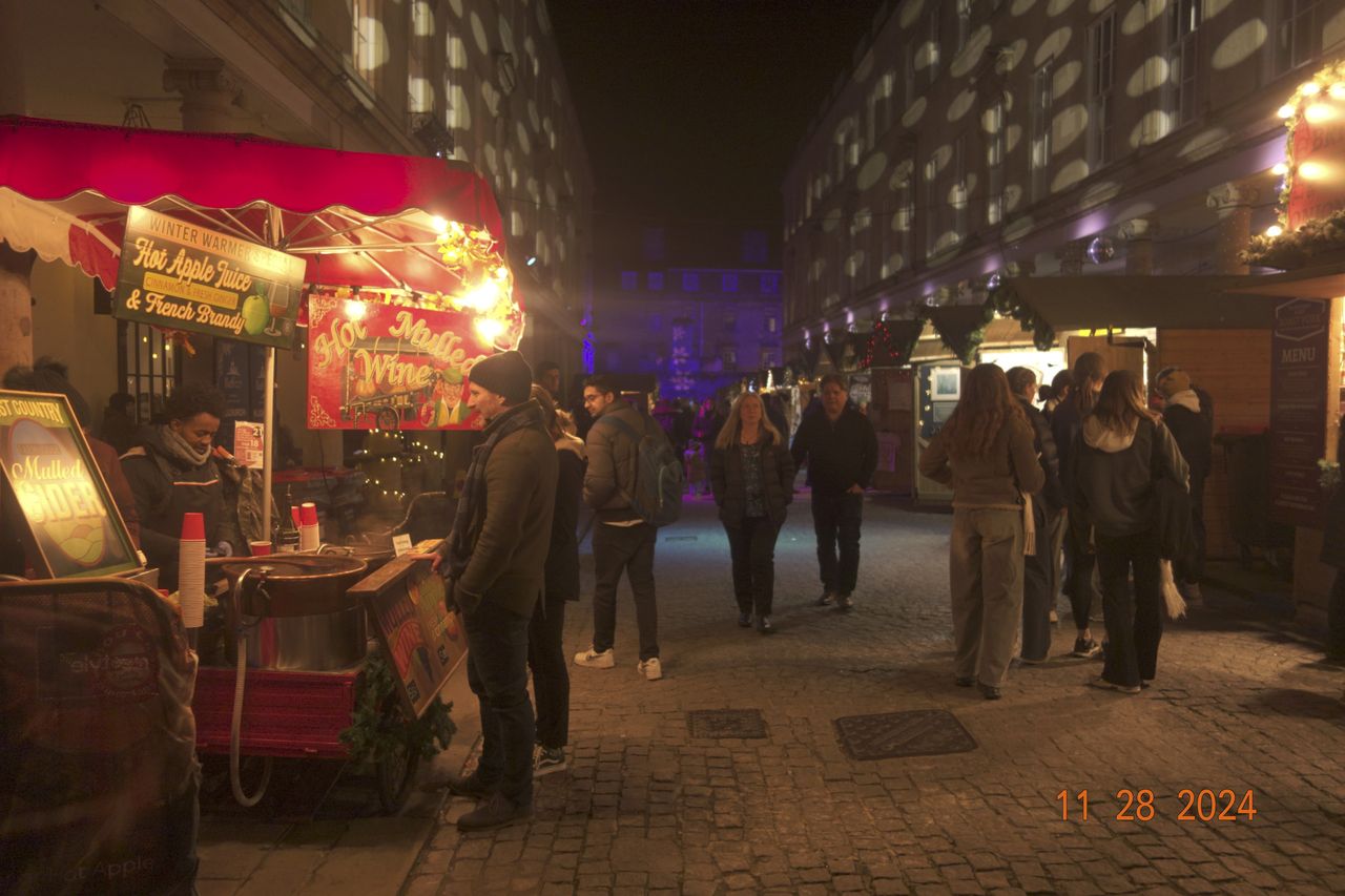Night street scene in the city of Bath, UK, with retro photo picture effect