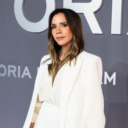 Victoria Beckham wearing a white suit on the red carpet