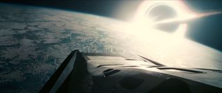 The titular interstellar spacecraft at the heart of the space epic "Interstellar" by director Christopher Nolan hangs above an alien world in this still from the final trailer released on Sept. 29. "Interstellar" opens nationwide on Nov. 7, 2014.