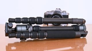 A Vanguard VEO 3GO 235CB tripod with a camera behind it