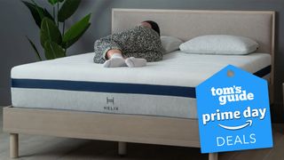 Sleep tester sleeping on a Helix mattress with Tom's Guide Prime Day tag