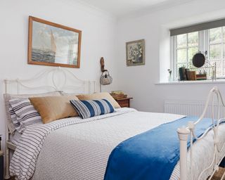 Blue and white country bedroom in Devon barn