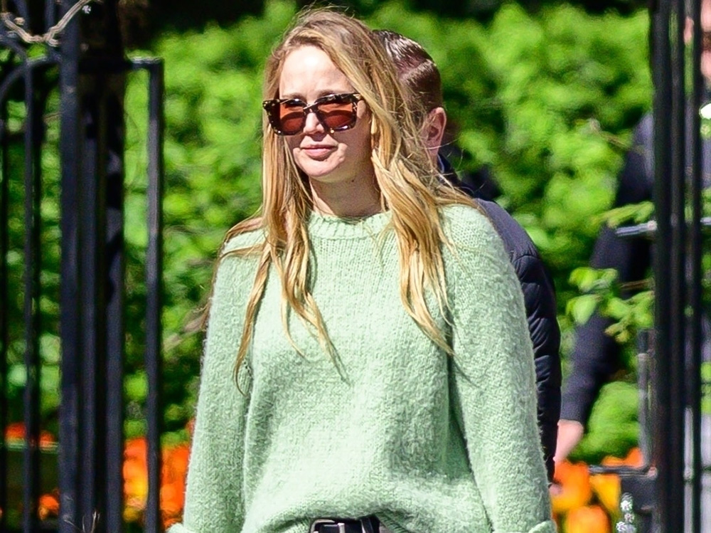 Jennifer Lawrence wearing a green sweater