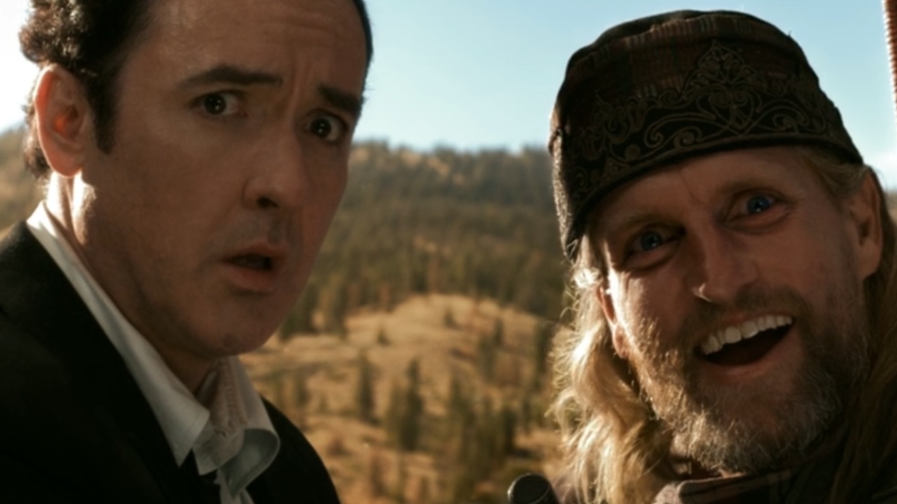 John Cusack looking scared and Woody Harrelson looking excited in 2012